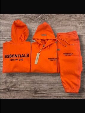 orange fear of god essentials tracksuit set